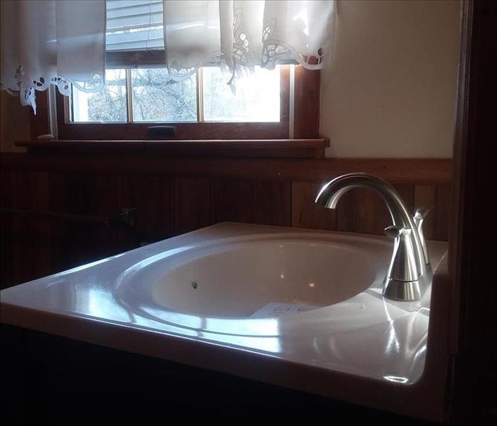 new black vanity with porcelain sink