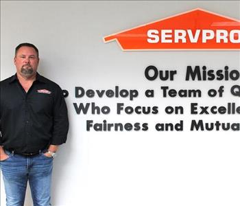 man in front of mission statement