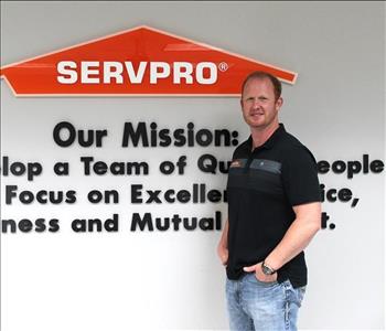 man in front of mission statement