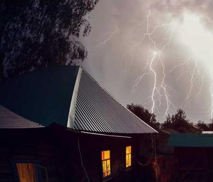 Flash of lightning over a house 