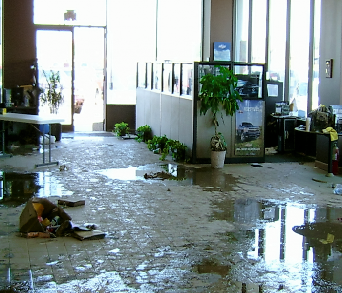 A business storefront with severe water damage