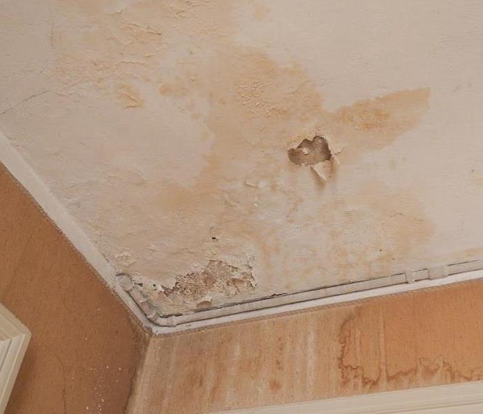 A picture of a ceiling with water damage
