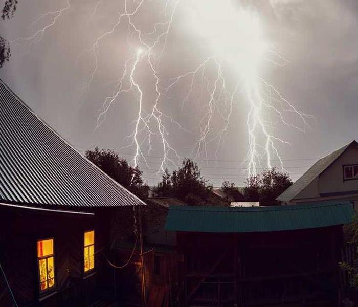 lightning storm around brick house